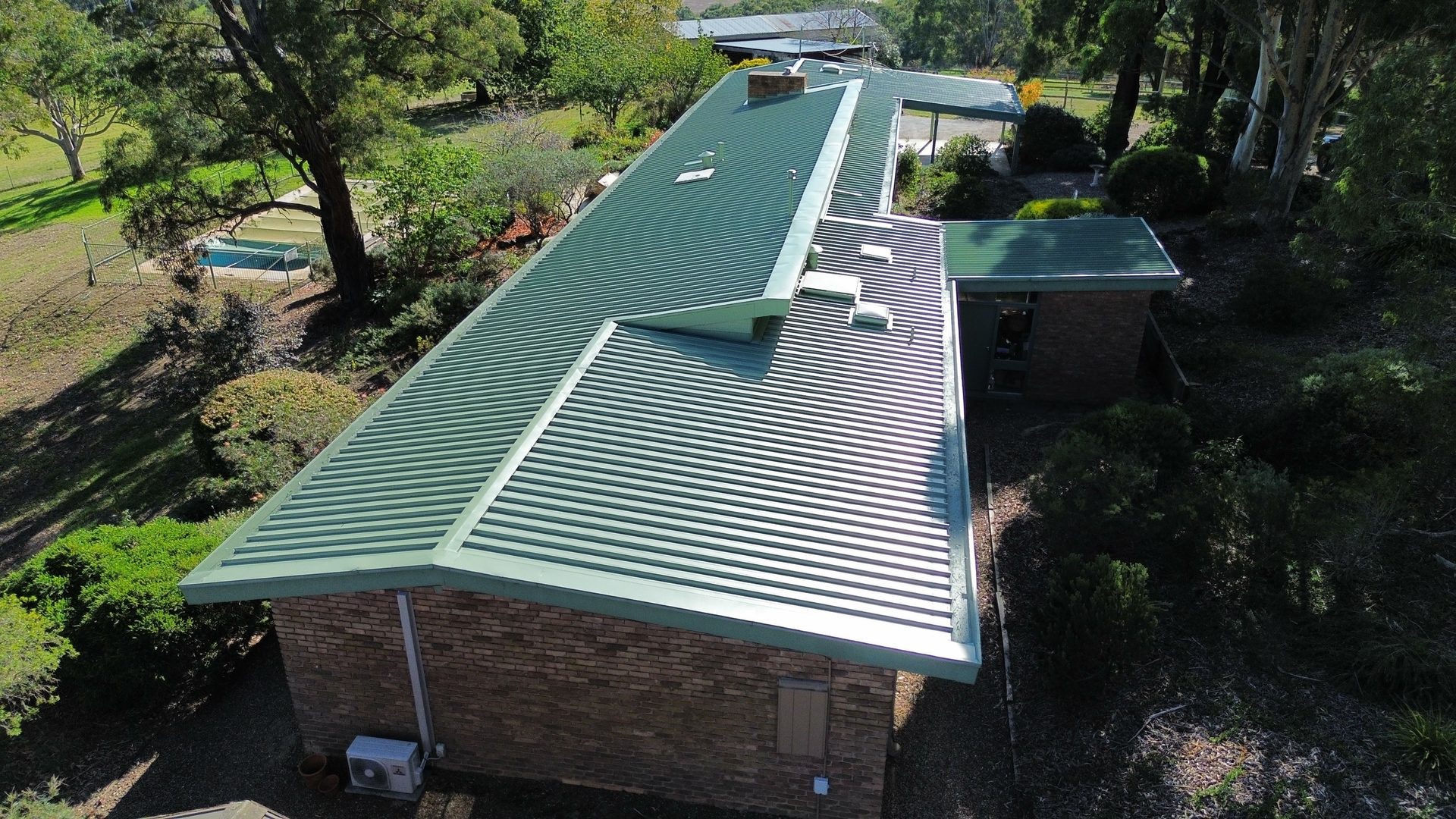 Same Colorbond roof restored in Pale Eucalypt sage finish